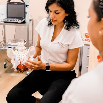 Women's health physiotherapist explaining pelvic anatomy to a patient at Embrace Physiotherapy, Singapore