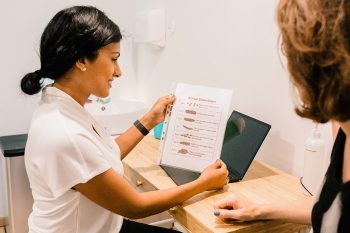 Women's health physiotherapist explaining pelvic anatomy to a patient at Embrace Physiotherapy, Singapore