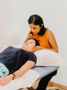 Women's health physiotherapist treating neck pain in Singapore'