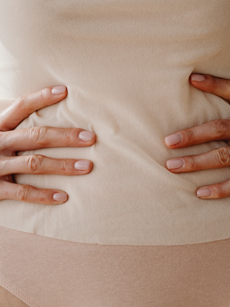 Woman sitting quietly reflecting on vaginismus and fertility concerns Singapore