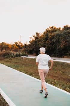Woman running outdoors in Singapore, exercising confidently with a prolapse